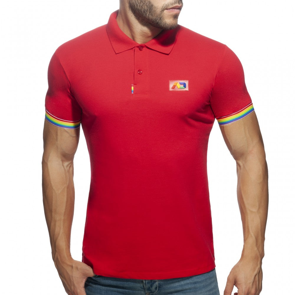 Red men’s polo shirt with rainbow trim on sleeves and a small colorful logo patch on the chest