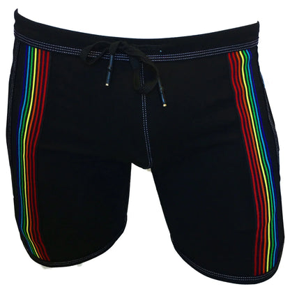Black swim trunks called rainbow ribbon shorts featuring vibrant rainbow stripes down each side for beachwear