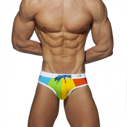 Rainbow swim brief featuring rainbow-striped fabric with a white waistband and blue drawstring for swimming