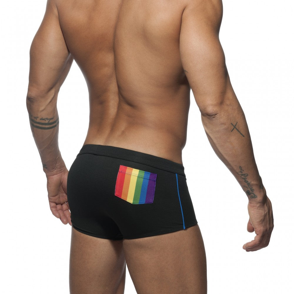 Black rainbow swim trunk with vibrant rainbow pocket and blue side trim ideal for swimming and beachwear