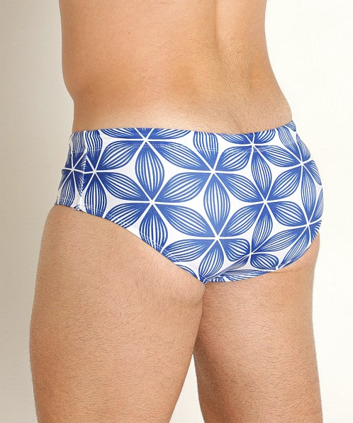 Redondo swim brief featuring blue and white patterned swim trunks with a geometric floral design