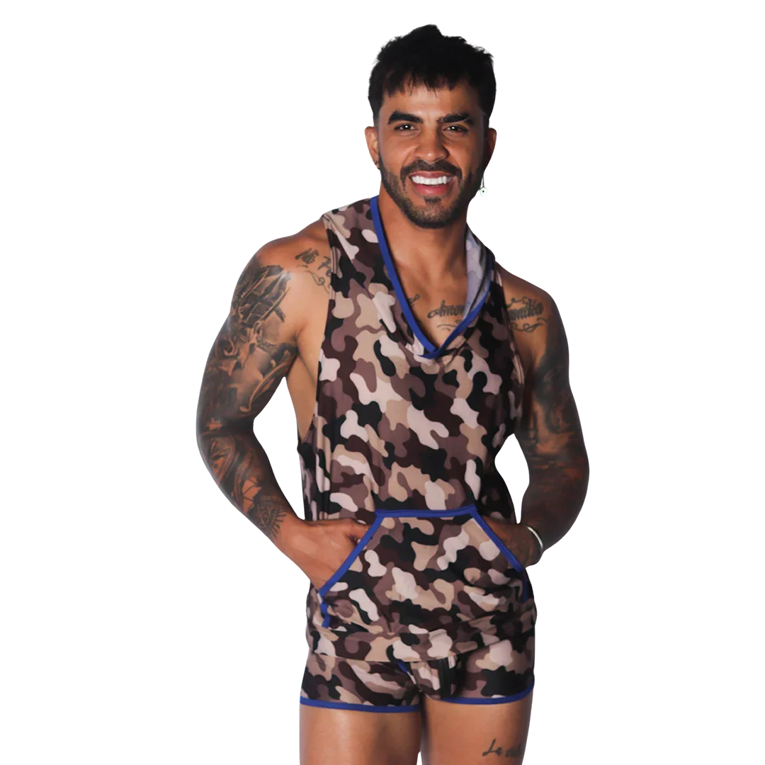 Sleeveless camo-print hooded shirt with a front kangaroo pocket and blue trim detail on a smiling tattooed man.
