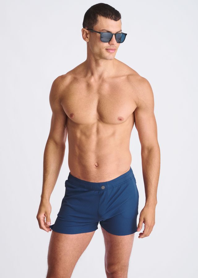 Navy blue Riviera seersucker swim shorts with mesh lining and single button closure at the waistband
