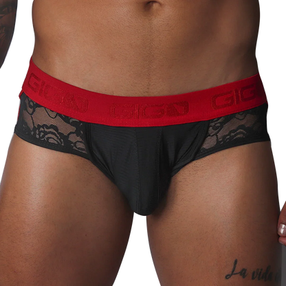 Black jock thong with floral lace side panels and a wide red elastic waistband featuring the Gigo logo.