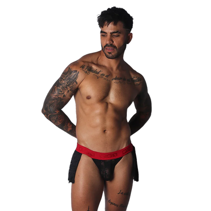 Black lace skirt with a bold red, branded elastic waistband worn by a muscular man.