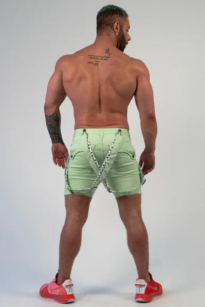 Romey shorts light green cargo shorts with black and white patterned straps shown from the back side