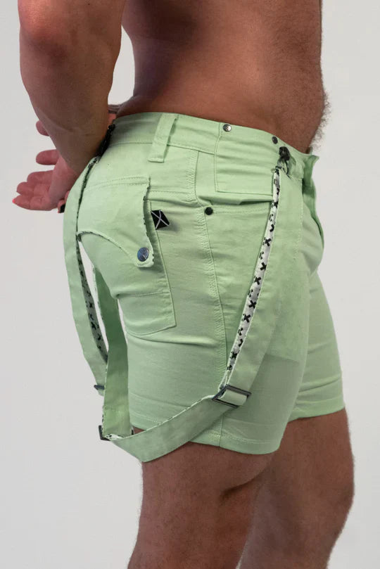 Romey shorts light green with black star patterned straps and a small black logo on the pocket front side