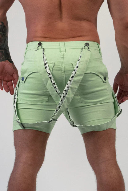Light green denim Romey shorts with black and white star-patterned suspenders for casual wear