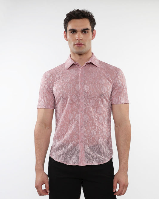A man wearing a pink roses leaves gossamer knit short-sleeved shirt with intricate floral lace pattern
