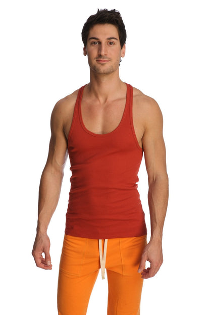 Red ribbed racer-back yoga tank in cinnabar with scoop neckline and straight hem for activewear use