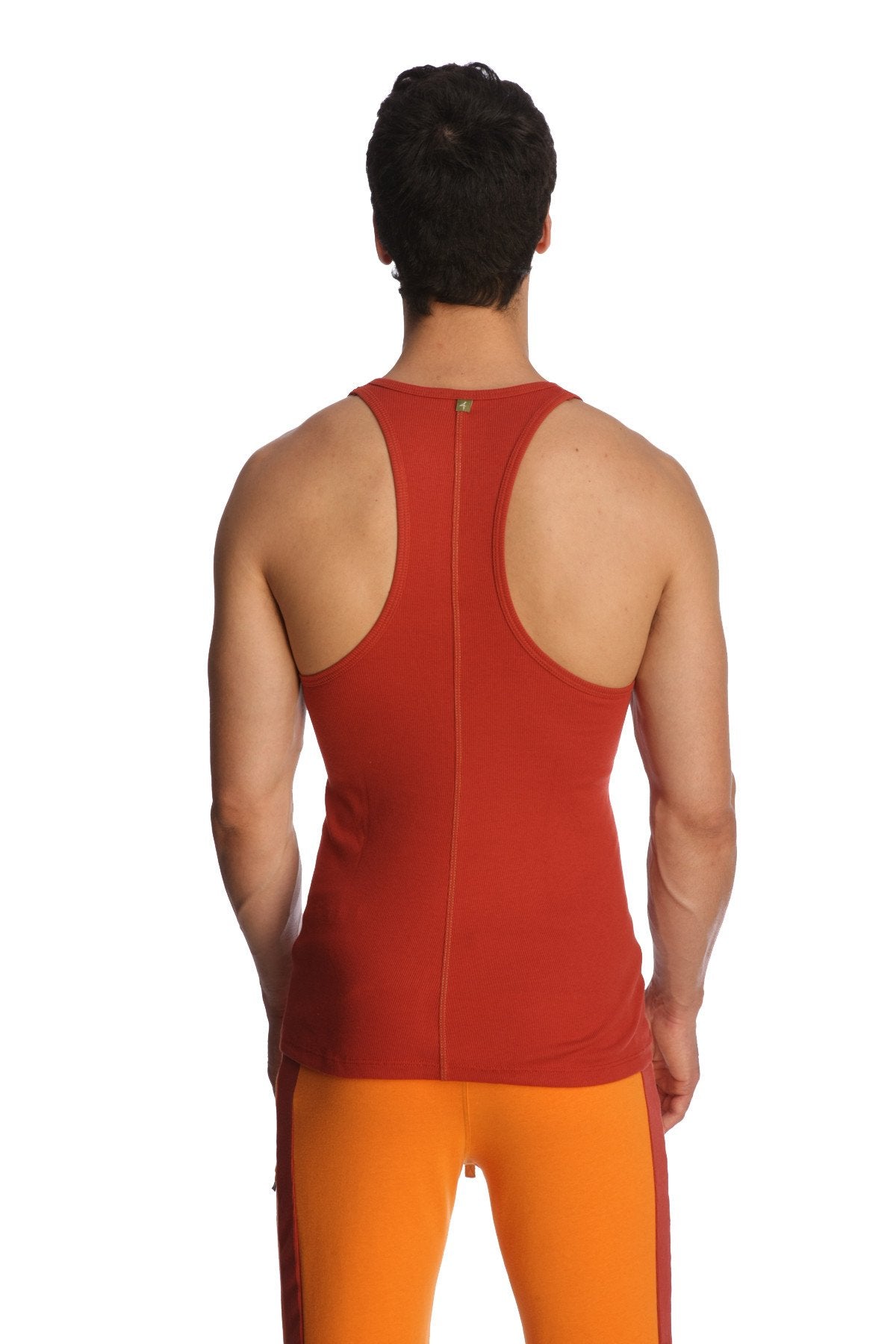 Back view of a red cinnabar racer-back yoga tank top with a central zipper down the back