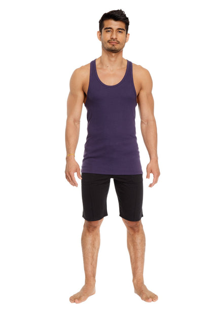 A man wearing an eggplant purple racer-back yoga tank with a rounded neckline and straight hem