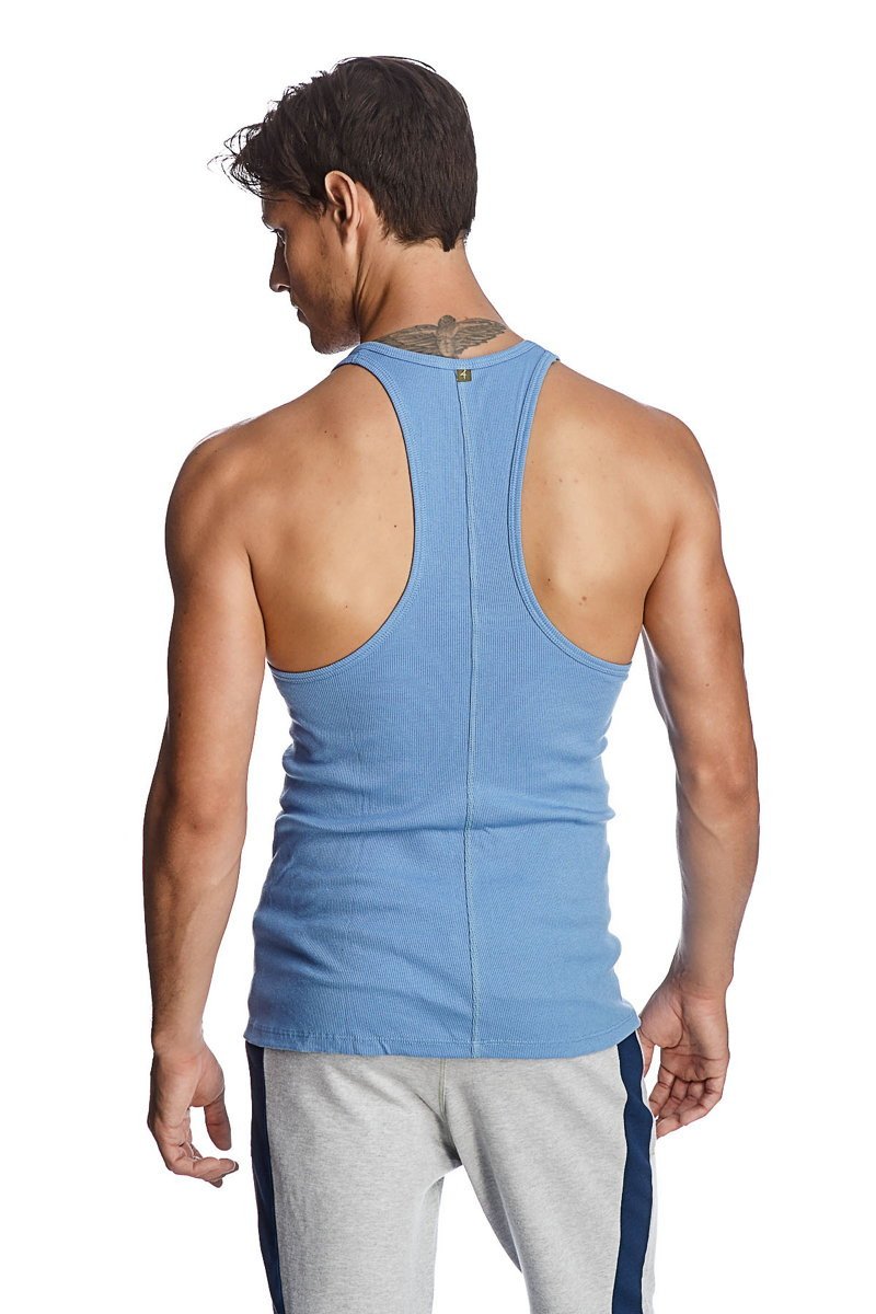 Light blue ribbed cotton racer-back yoga tank top with a small green logo at the neckline
