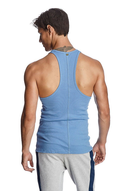 Light blue ribbed cotton racer-back yoga tank top with a small green logo at the neckline
