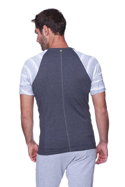 Back view of raglan virtual crew neck charcoal with grey and white striped raglan sleeve t-shirt with central zipper