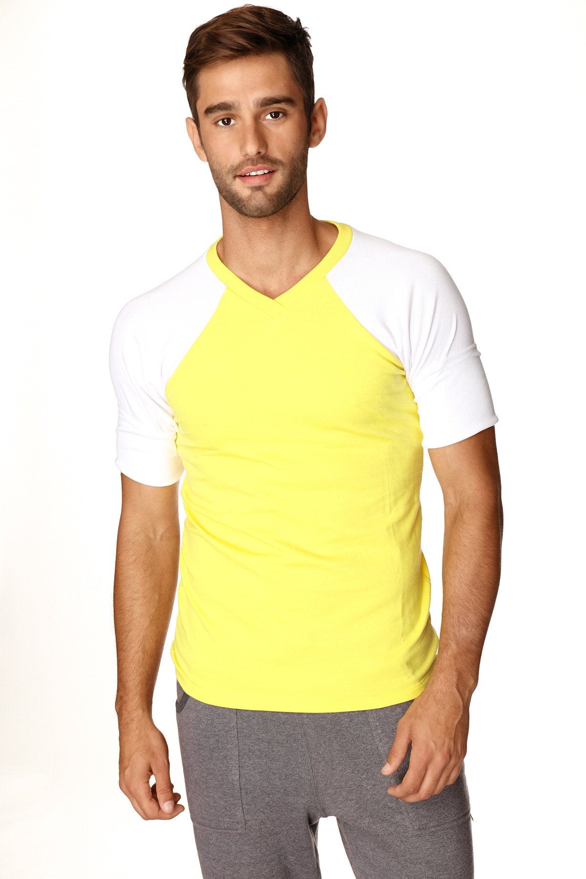 Bright yellow and white raglan sleeve v-neck t-shirt made of soft fabric for casual and active wear