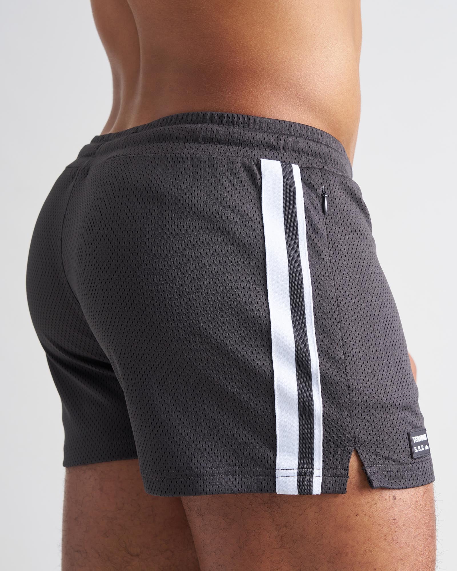 Dark gray s.s.c. fraternity 3 mesh shorts with bold white side stripes and black brand tag at the hem