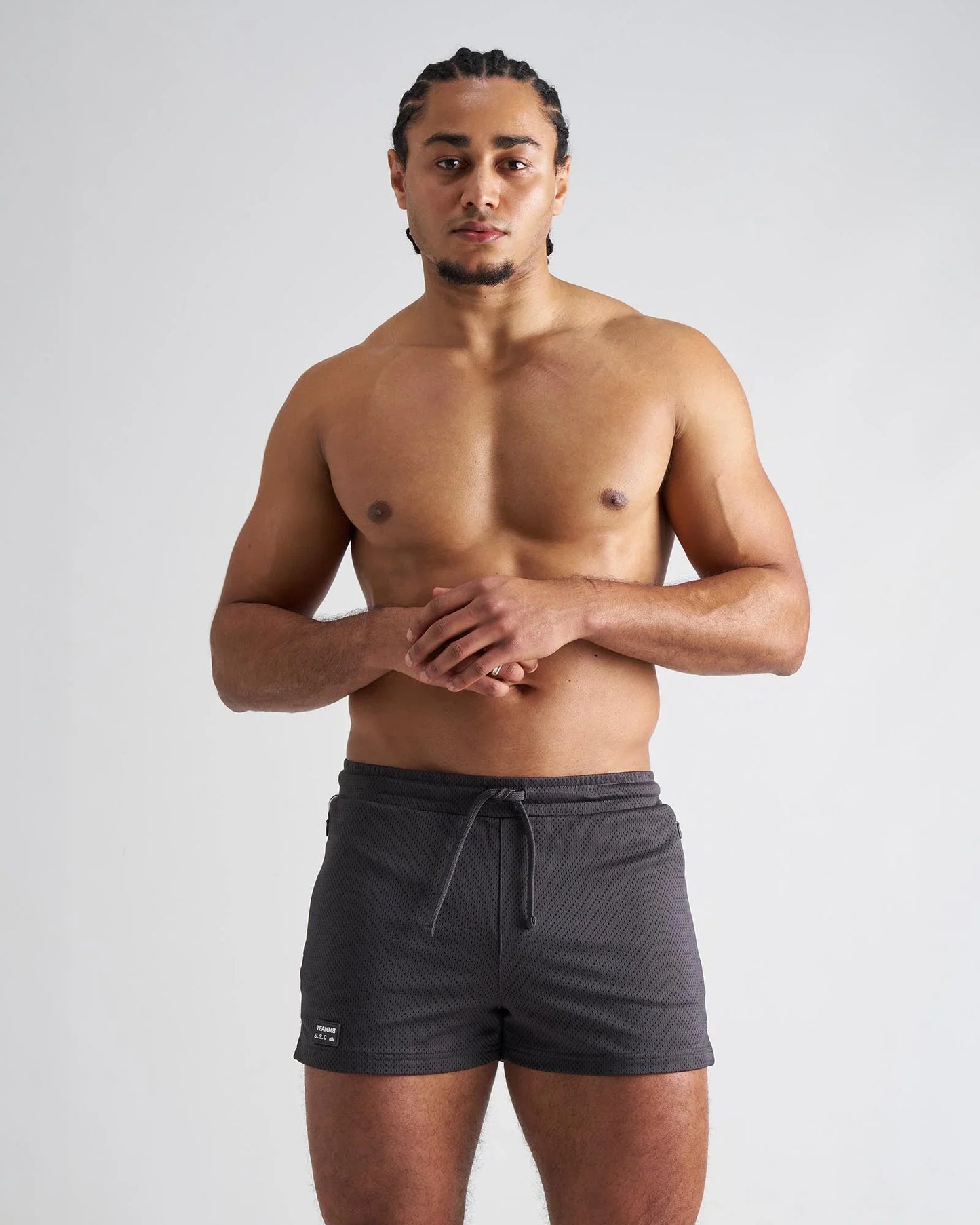Dark gray s.s.c. fraternity 3 mesh shorts with drawstring waistband textured fabric and small brand tag on lower left leg