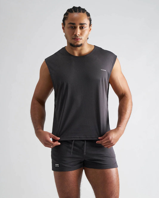 Dark gray sleeveless ssc mesh muscle tank with textured mesh fabric and subtle chest branding for athletic use
