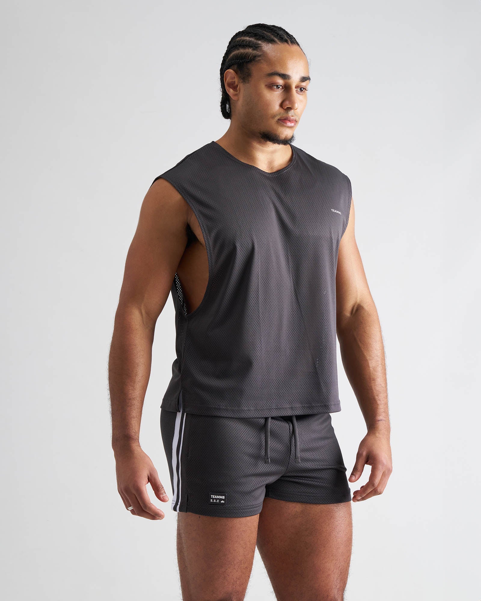 Dark gray sleeveless athletic top with textured mesh fabric and cut-out side panels s.s.c. mesh muscle tank