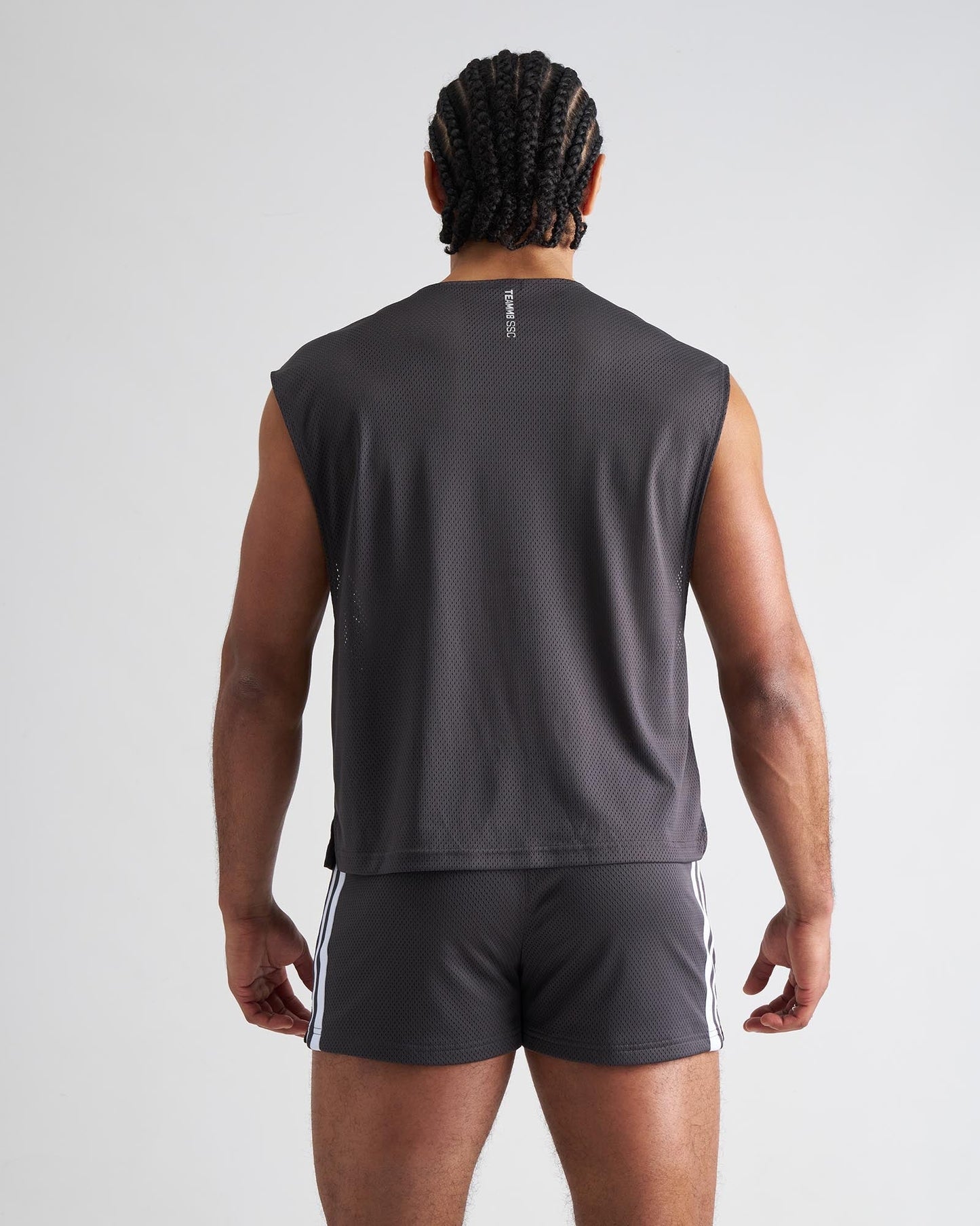 Dark gray mesh sleeveless s.s.c. muscle tank showing the back with a subtle vertical logo on the mesh fabric