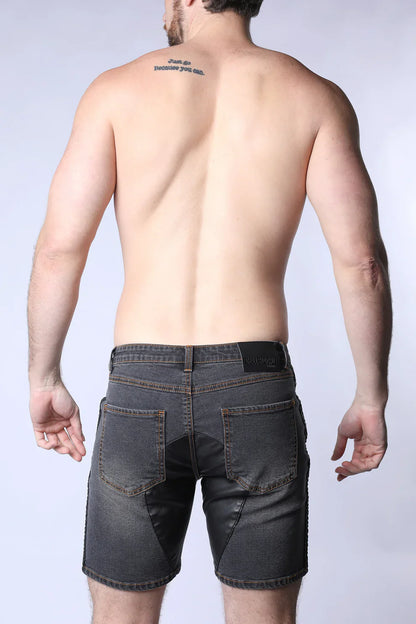 Dark gray denim shorts with a black leather Saddleback denim short brand patch on the waistband back side view