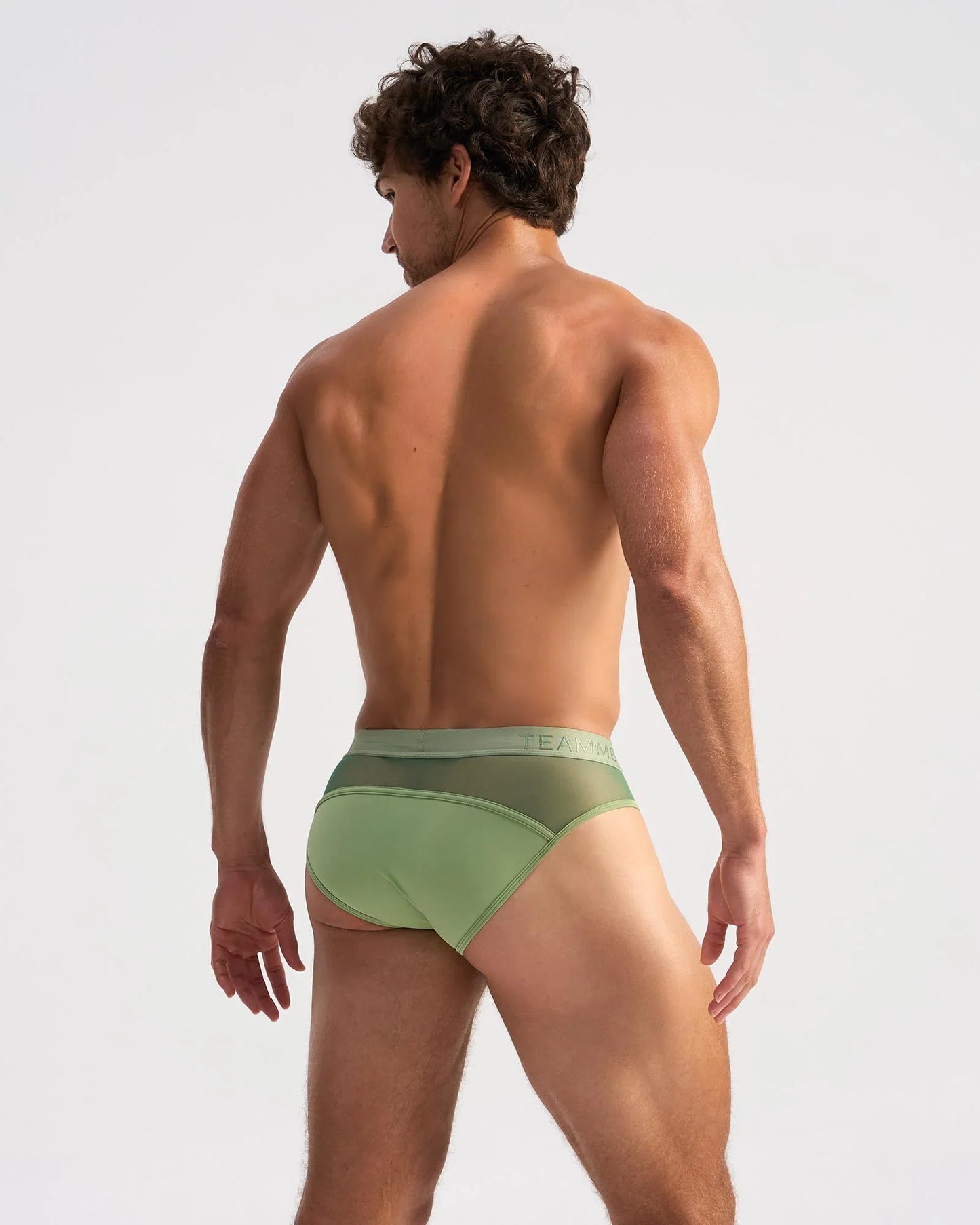 Light green score sheer brief showcasing a form-fitting design with a subtle mesh back panel and elastic waistband