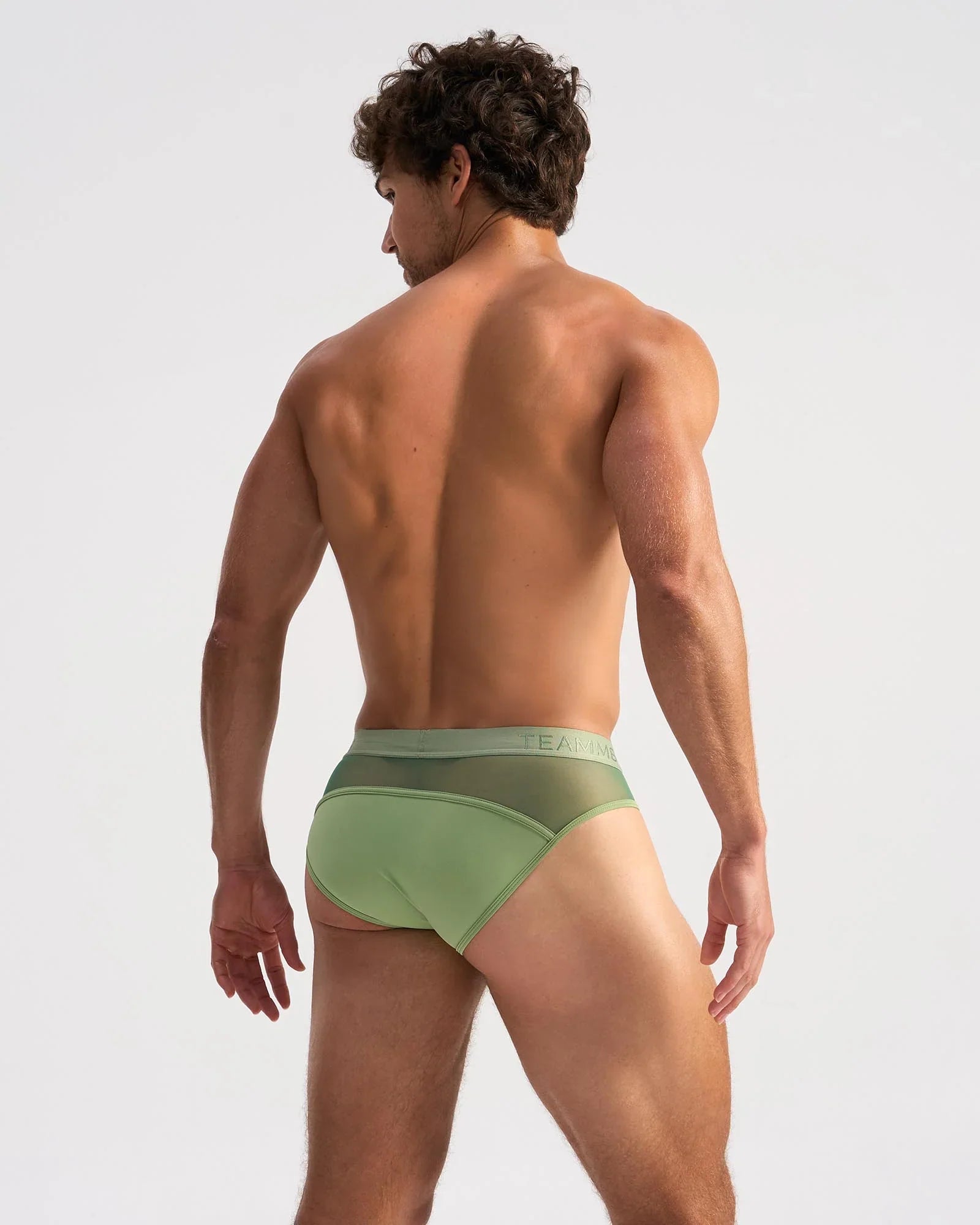 Light green score sheer brief showcasing a form-fitting design with a subtle mesh back panel and elastic waistband