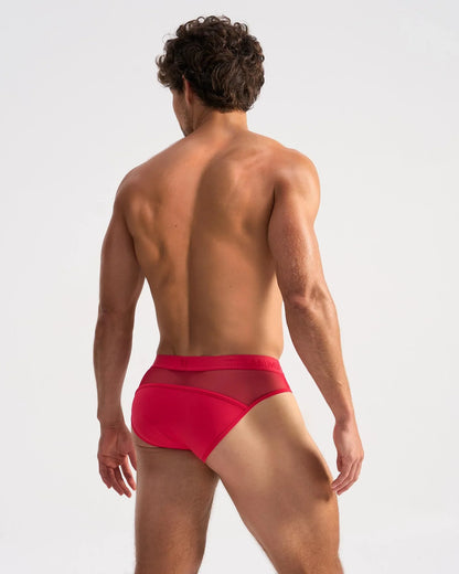 Red men’s brief with sheer mesh panel at the back from the score sheer brief collection