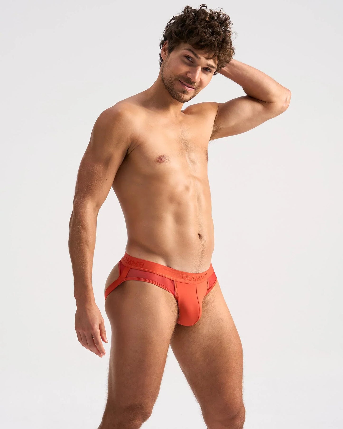 Bright orange score sheer jock briefs with sleek modern design and subtle branded waistband for comfortable wear