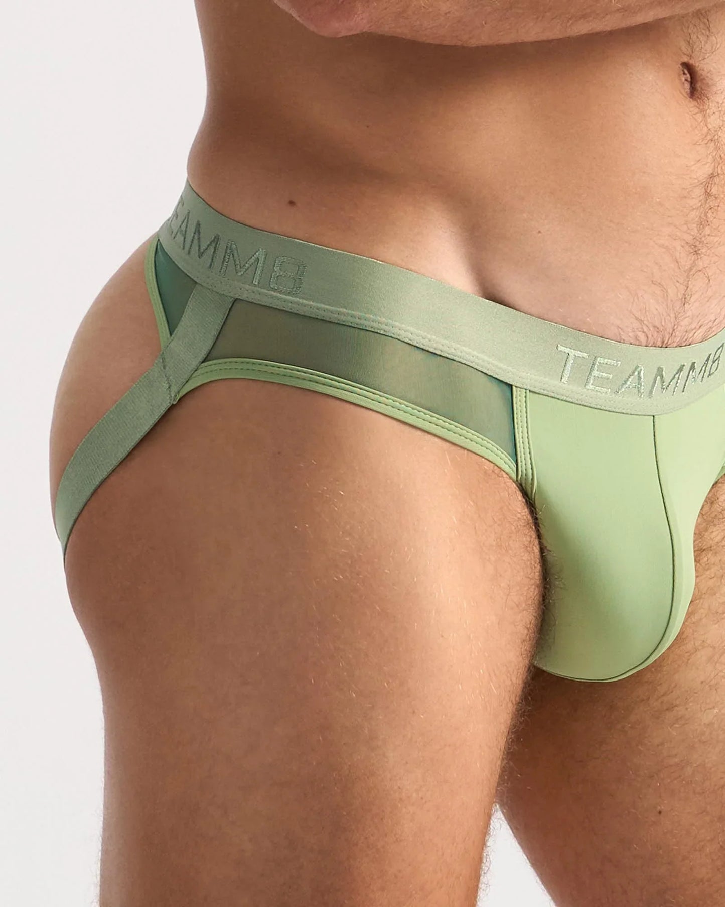 Light green teammb score sheer jock briefs with smooth, form-fitting design and sheer fabric for comfort and style