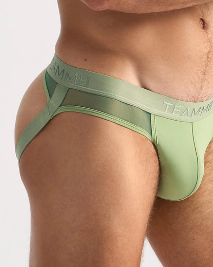 Light green teammb score sheer jock briefs with smooth, form-fitting design and sheer fabric for comfort and style