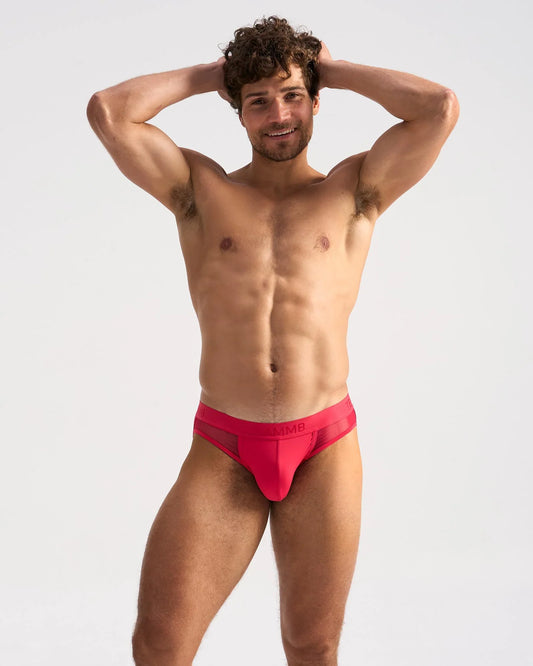 Bright red mesh textured men’s briefs with a modern design and subtle brand logo on the waistband score sheer jock