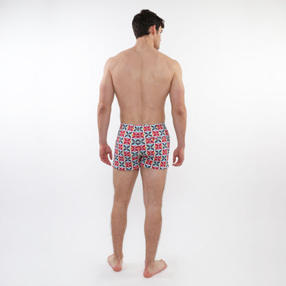 Men’s seersucker swim shorts with mesh lining featuring a bold red navy blue and white geometric pattern