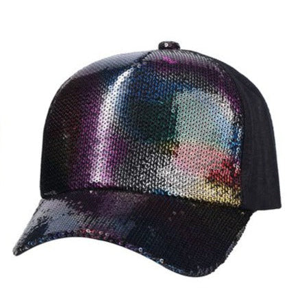 A black sequin baseball cap with a shimmering galaxy-themed front panel in iridescent purples and blues