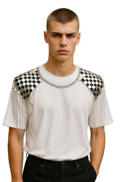 White t-shirt with black and silver checkered shoulder panels featuring dangling chain tassels for a stylish look