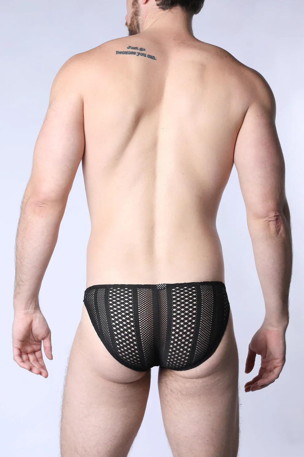 Black mesh sicily crochet low rise swim brief with small evenly spaced holes across the fabric