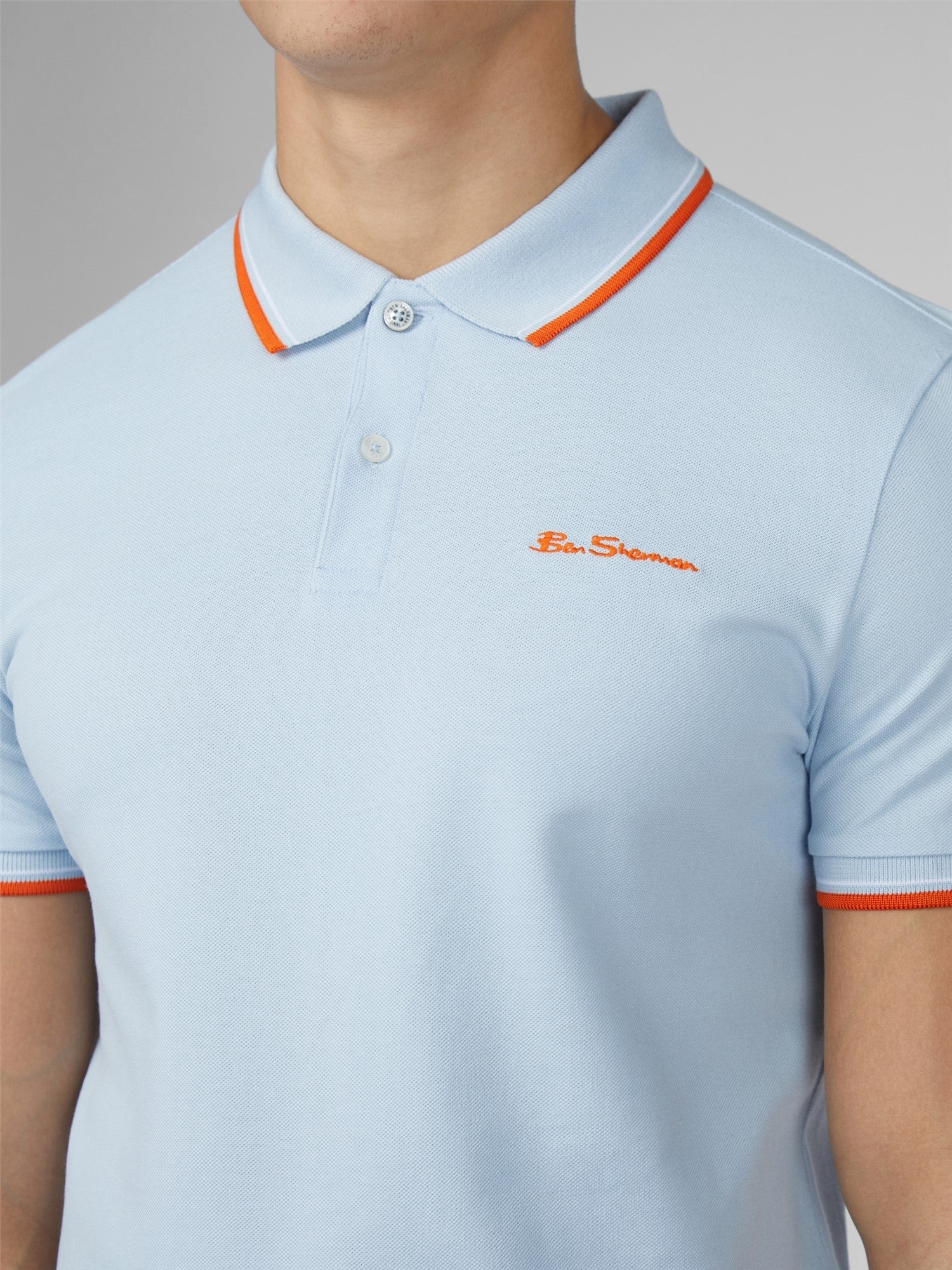 Light blue pique signature polo shirt with orange trim and embroidered ben sherman logo in matching orange thread