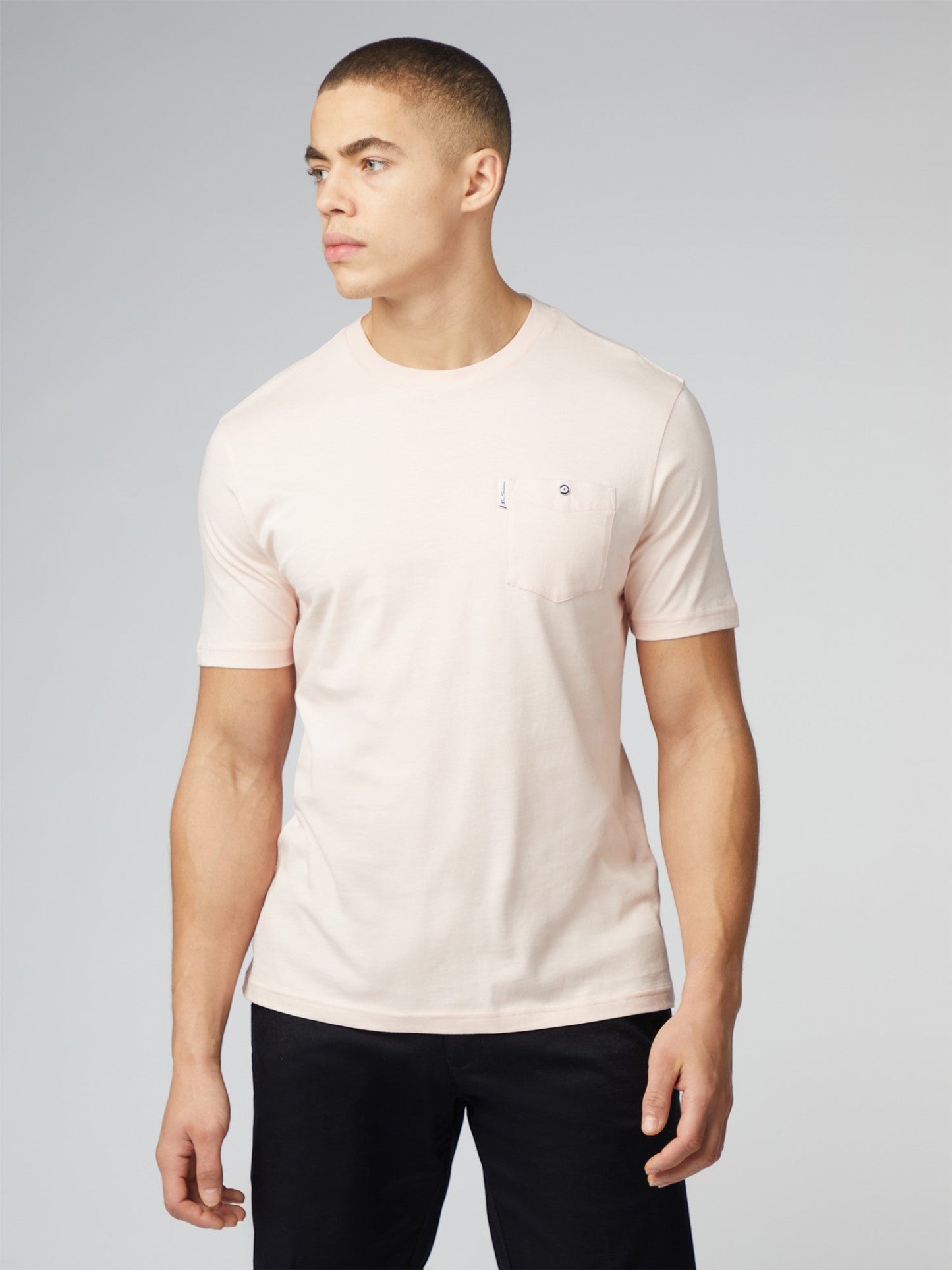 Signature t-shirt with chest pocket is a soft blush pink short-sleeved crew neck tee with subtle embroidered logo