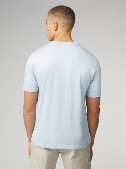 A light blue signature t-shirt with chest pocket made of soft cotton fabric and short sleeves