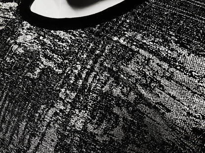 Black lace silver leaf tee with intricate textured pattern showcasing detailed craftsmanship