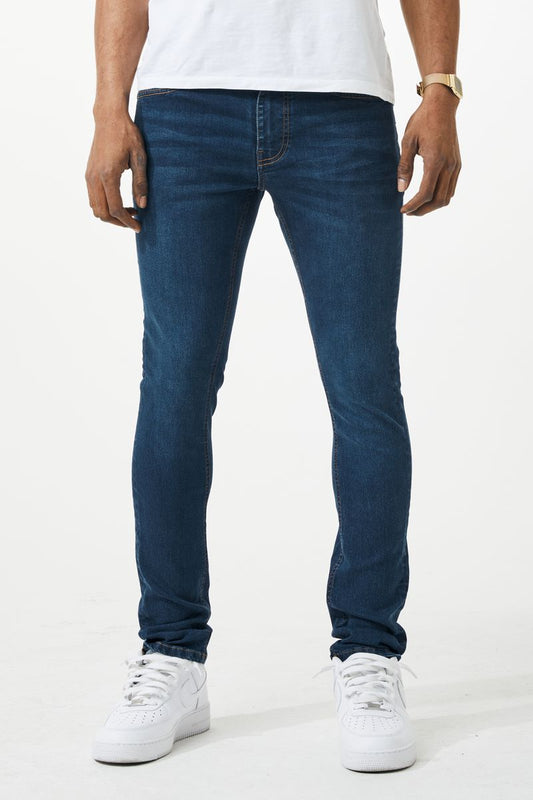 Dark blue skinny fit denim jeans with slim fit, classic five-pocket design, and subtle fading on thighs