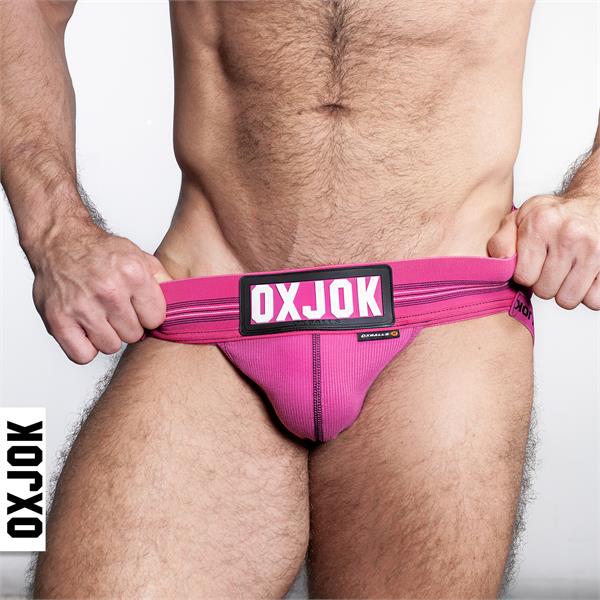 Bright pink slingjock jockstrap briefs with ribbed texture and black oxjok logo patch