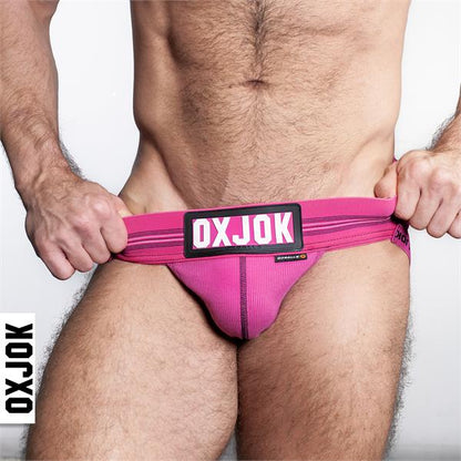 Bright pink slingjock jockstrap briefs with ribbed texture and black oxjok logo patch