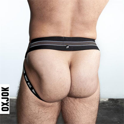 Black oxjok slingjock jockstrap with silver horizontal stripes and a small white logo on the waistband