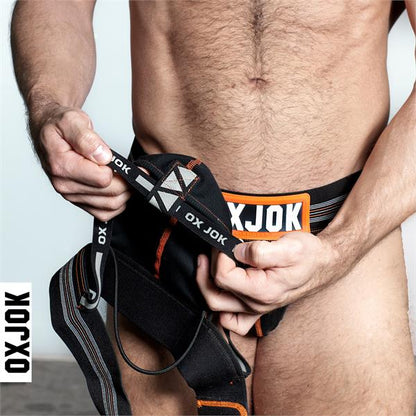 Black and orange oxjok branded slingjock jockstrap athletic briefs with bold logo waistband for support and comfort