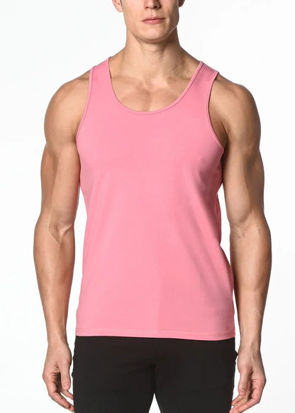 A sleek solid pink sleeveless solid stretch jersey tank top with rounded neckline and smooth fabric