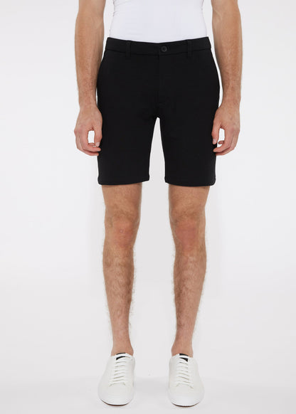 Black solid stretch knit short tailored chino shorts with modern cut and subtle stitching details
