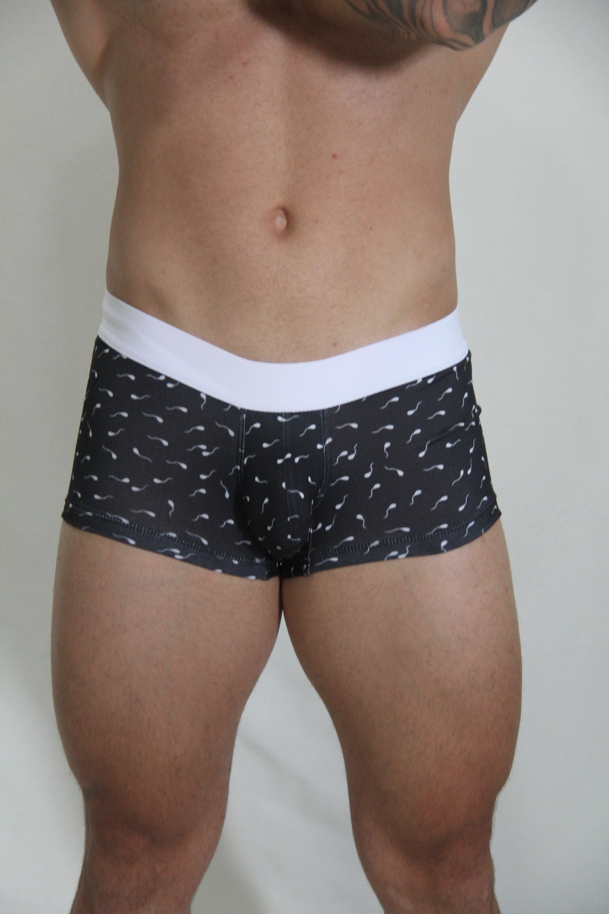 Black sperm trunk boxer briefs with white elastic waistband and light mustache pattern for comfortable everyday wear