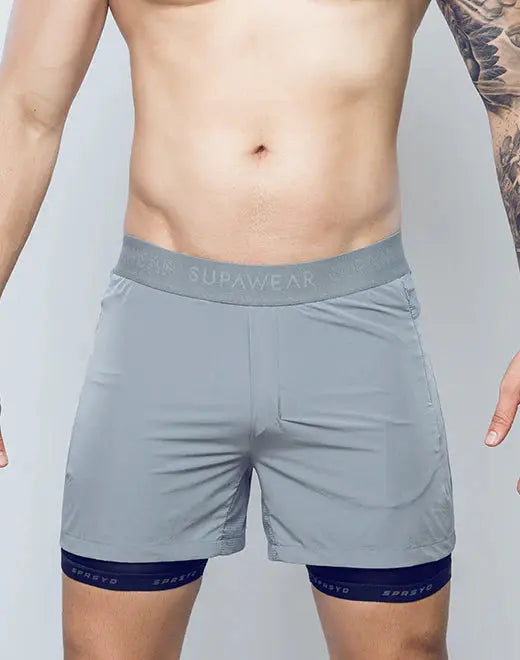 Gray supawear spr flex short athletic shorts with matching waistband and navy blue trim at the hem